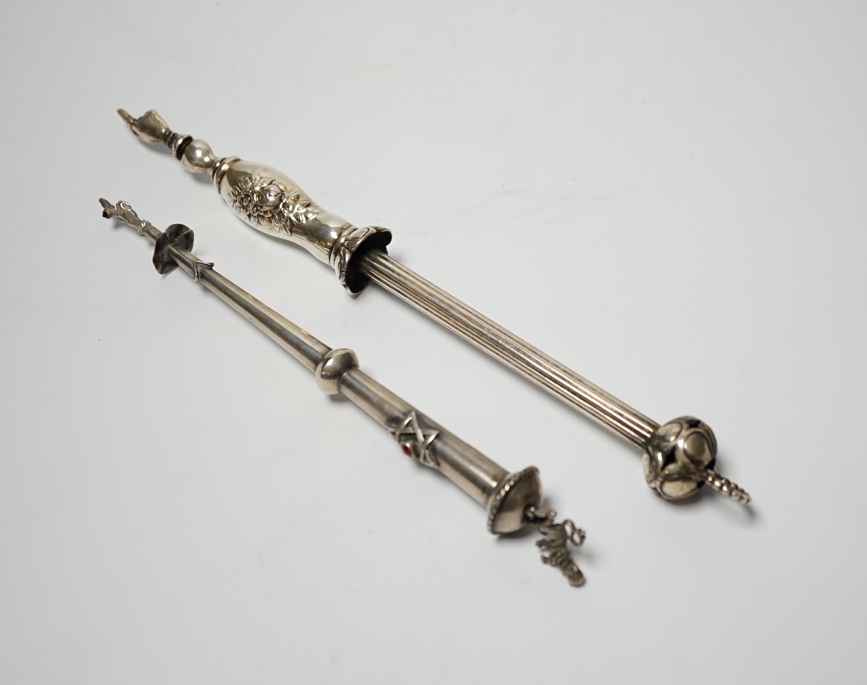 A late 19th century Russian 84 zolotnik torah pointer, with lion finial, 21.5cm and a plated example.